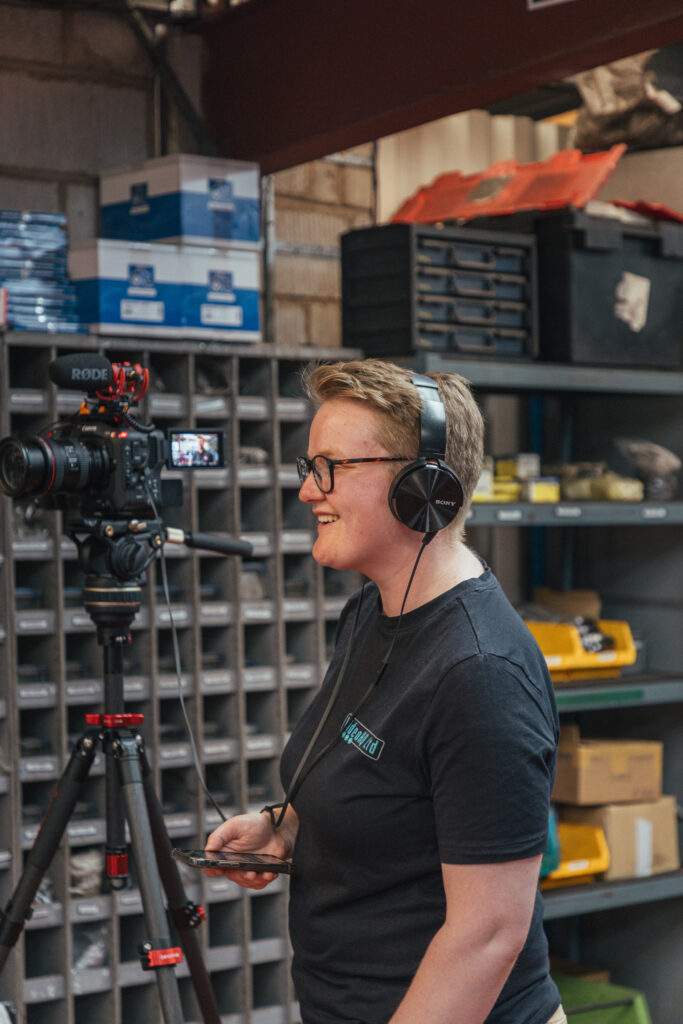 VideoHQ director Hannah Quinn interviewing a testimonial interviewee on site at Direct Parts Ltd in Staffordshire